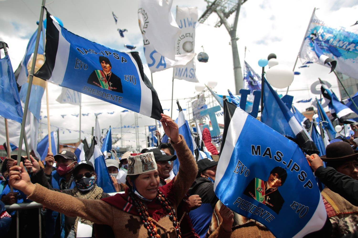 People holding flags in a rally