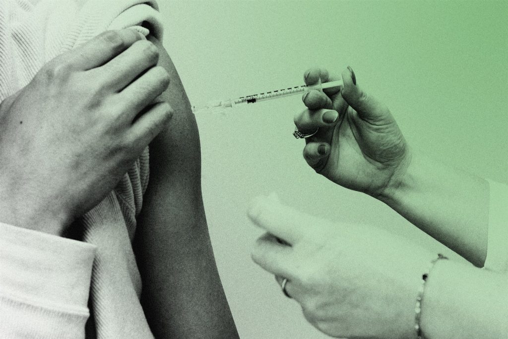Stylized image of a person receiving a vaccination shot in their upper arm.
