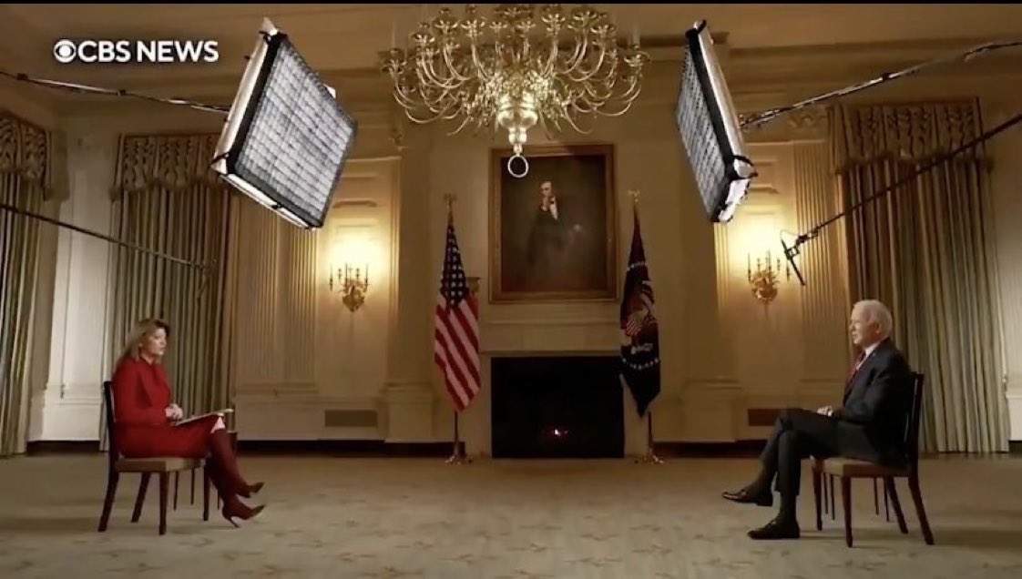 Biden sits far apart from a CBS interviewer.