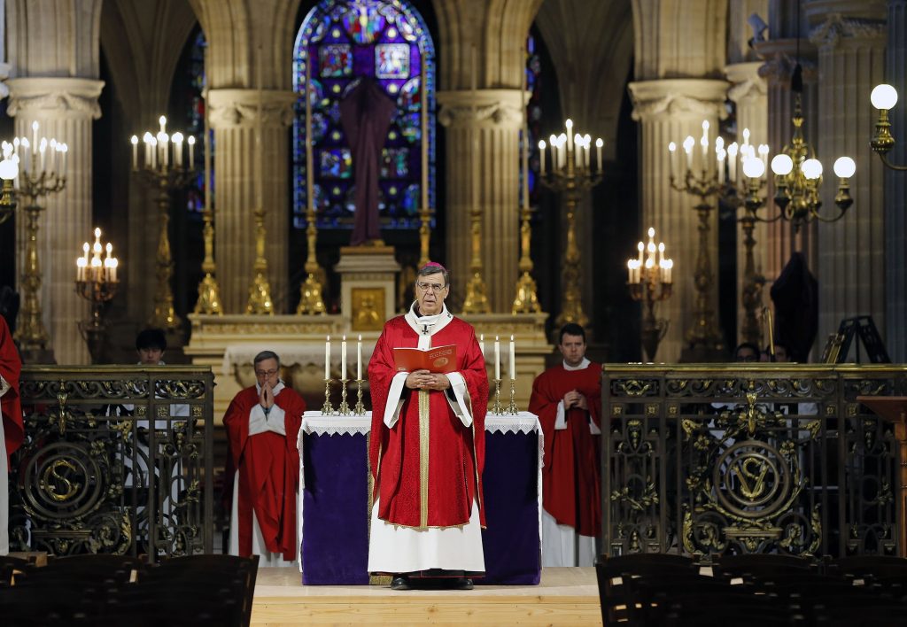 Archbishop of Paris Michel Aupetit conducts Palm Sunday mass behind closed doors and inside an empty church at "Saint-Germain-l'Auxerrois" during the early days of the COVID-19 pandemic, Paris, France, April 5, 2020.