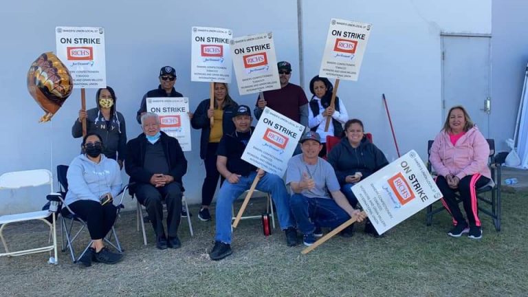 Strikers at Rich Foods in the Los Angeles area pose with picket signs