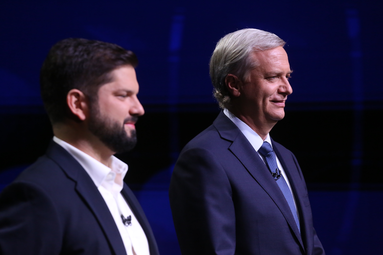 President elect Gabriel Boric of the Social Convergence party and Republican Party candidate José Antonio Kast pose before a presidential debate in Santiago, Chile, on Dec. 13.