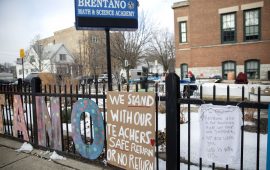 Signs outside of a Chicago public school in support of teachers