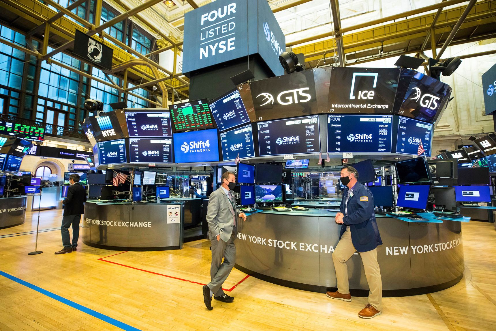 Three men at the New York Stock Exchange