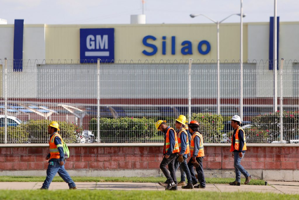 Workers leaving a General Motors facility in Silao, Mexico, in 2019