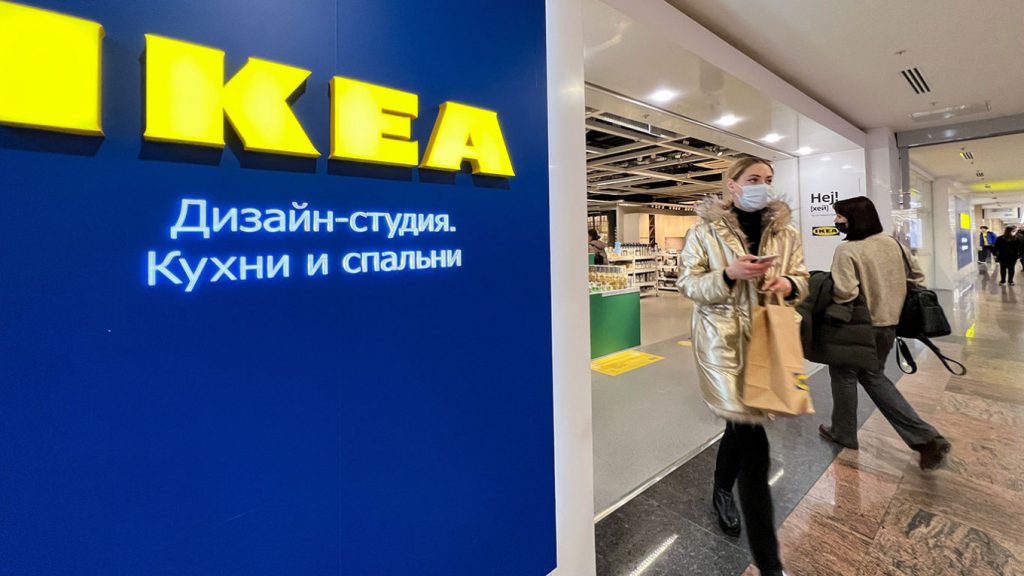 A Russian IKEA store. Masked patrons exit and enter on the right.
