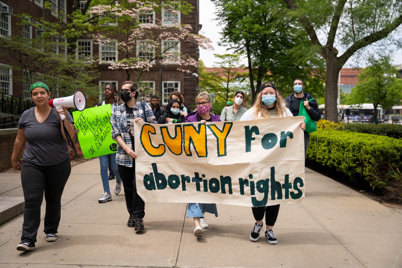 Protesters rally outside Brooklyn College on Friday, May 13. A banner reads "CUNY for abortion rights."