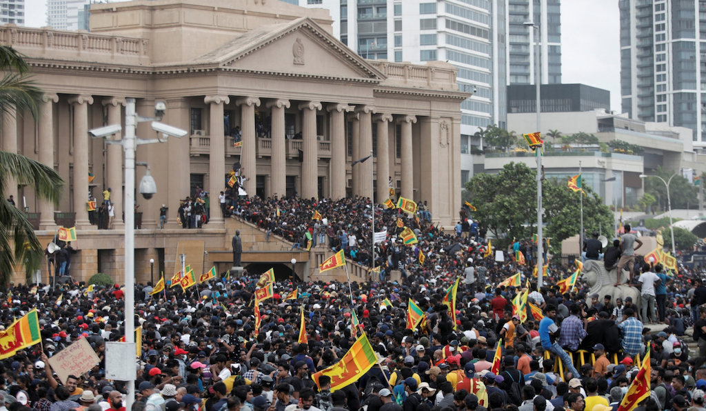 Demonstrators celebrate after entering into the Presidential Secretariat, after President Gotabaya Rajapaksa fled in Colombo, Sri Lanka July 2022