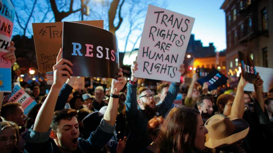 People take part in rally outside the Stonewall Inn, a landmark of the gay rights movement, on February 23, 2017 in the Greenwich Village area of New York City, demanding to maintain protection for transgender and gender non-conforming people.