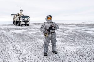 A soldier holds a machine gun as he patrols the Russian northern military base on Kotelny island, beyond the Arctic circle on April 3, 2019. The Russian military base is home to 250 soldiers and is to serve as a model for future military installations in the Arctic.