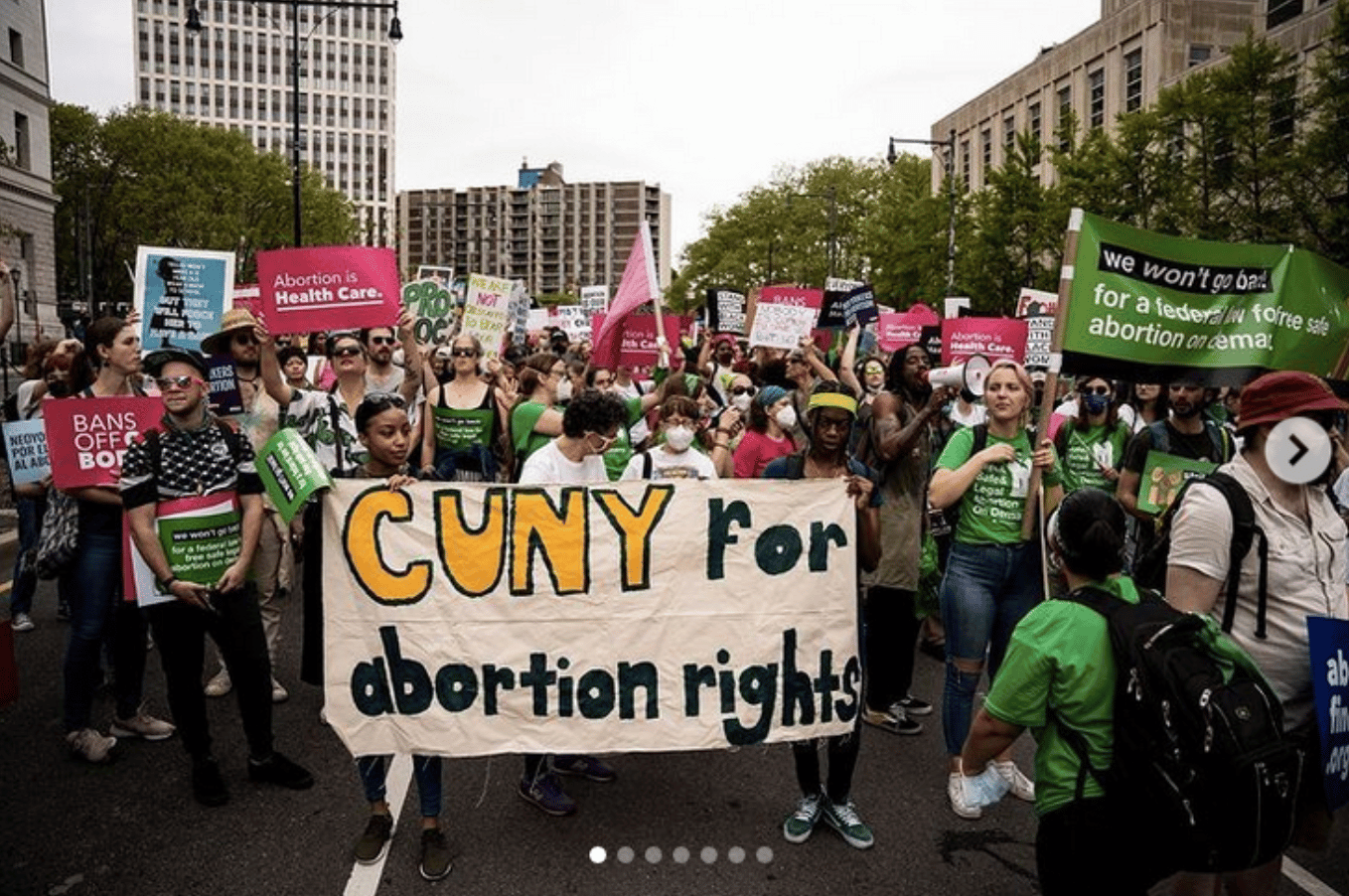 Students marching with a banner that reads CUNY for Abortion Rights