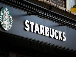 The Starbucks sign on an open store