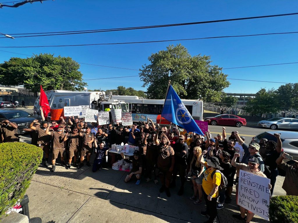 UPS workers and supporters raise their fists in solidarity at a rally on Thursday September 1.