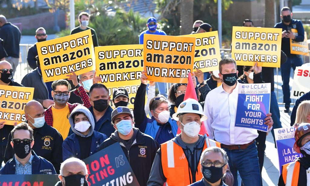 Union leaders are joined by community group representatives, elected officials and social activists for a rally in support of unionization efforts by Amazon workers in the state of Alabama on March 21, 2021 in Los Angeles, California. - Workers and organizers are pushing for what would be one of the biggest victories for labor in the United States over the past few decades if successful in the first Amazon warehouse union election in Bessemer, Alabama, where worker's ballots must reach the regional office of the National Labor Relations Board by March 29 to be counted.