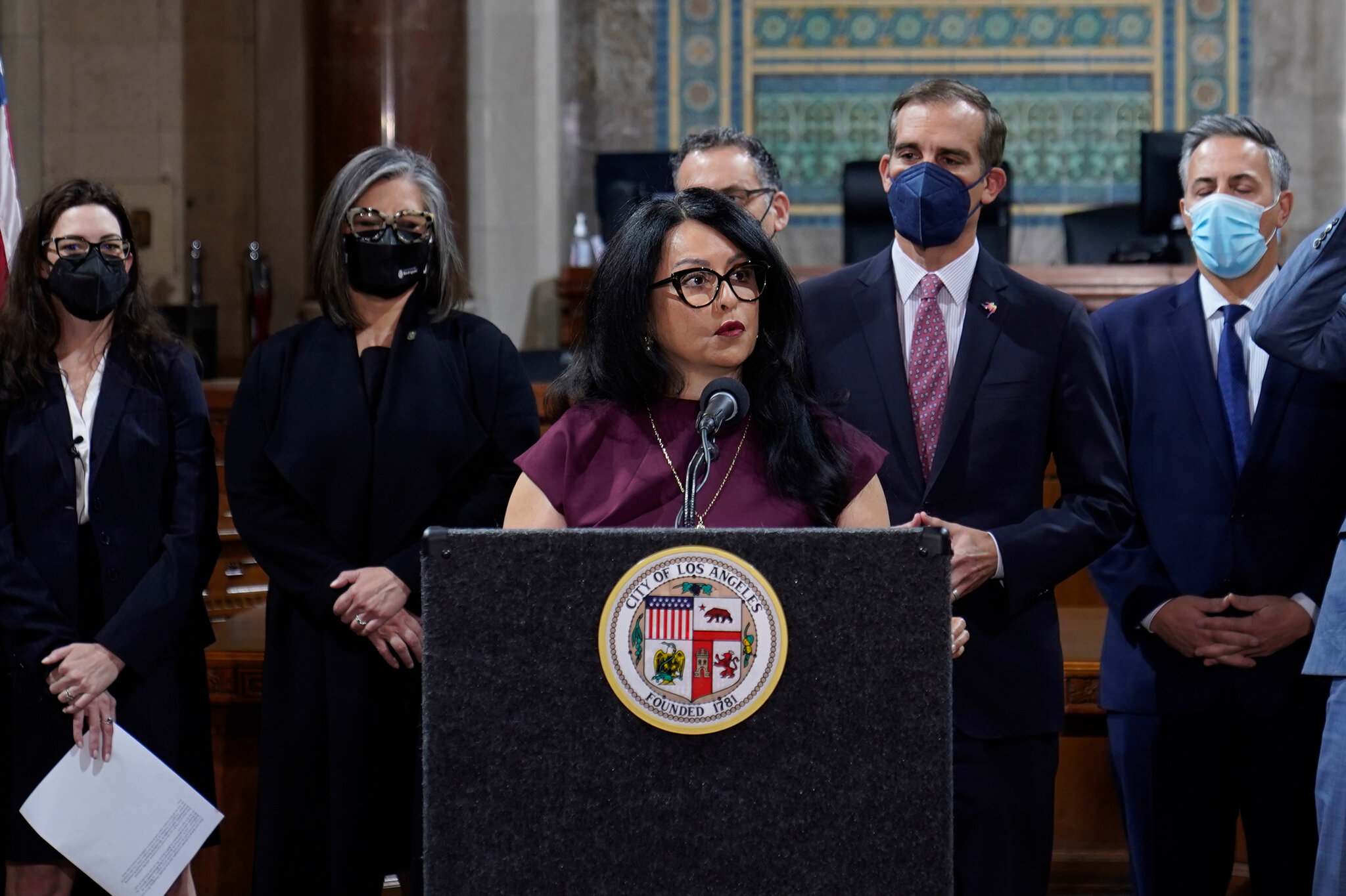 Former LA City Council president Nury Martinez, a Latina woman, stands at a podium.
