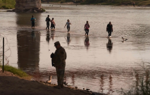 Migrants crossing the Rio Grande from Mexico to the United States near Eagle Pass, Texas.