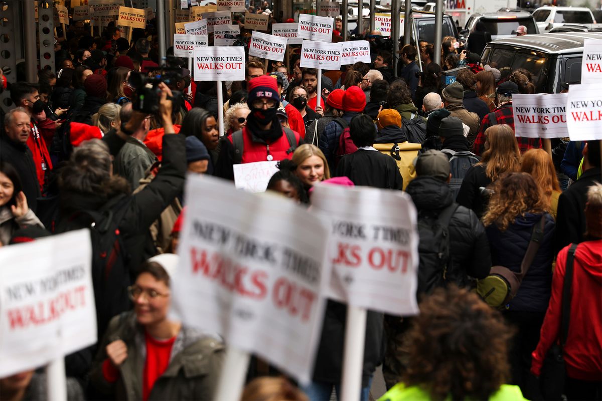 New York Times journalists and other staff protest outside the Times' office in New York on December 8 2022.