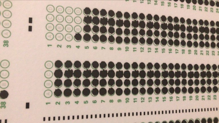 A horizontal testing scantron with almost all of the bubbles filled in
