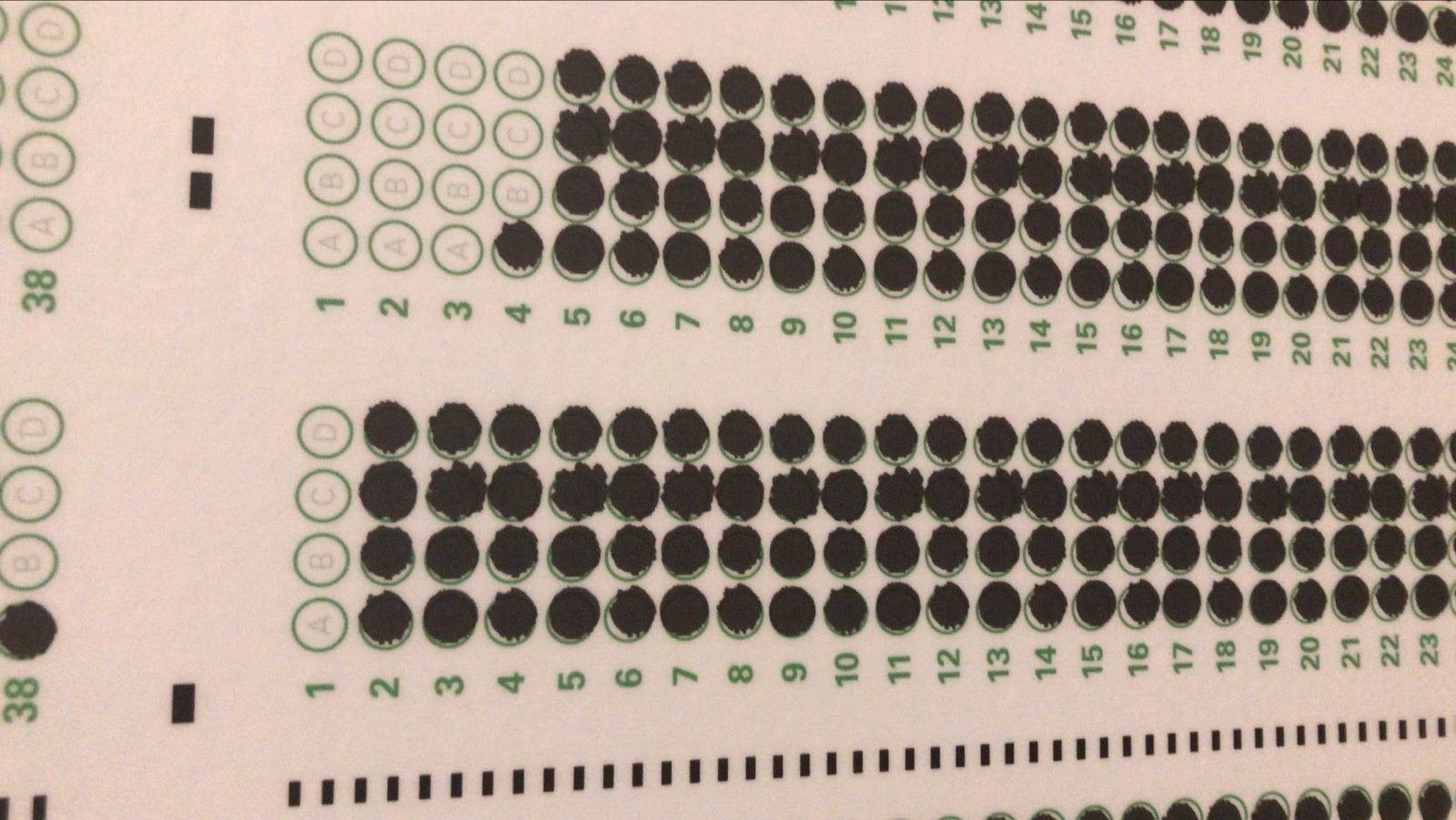 A horizontal testing scantron with almost all of the bubbles filled in