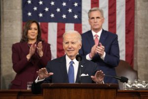 US President Joe Biden speaks during a State of the Union address with US Vice President Kamala Harris, left, and US House Speaker Kevin McCarthy, a Republican from California, right, at the US Capitol in Washington, DC, US, on Tuesday, Feb. 7, 2023. Biden is speaking against the backdrop of renewed tensions with China and a brewing showdown with House Republicans over raising the federal debt ceiling.