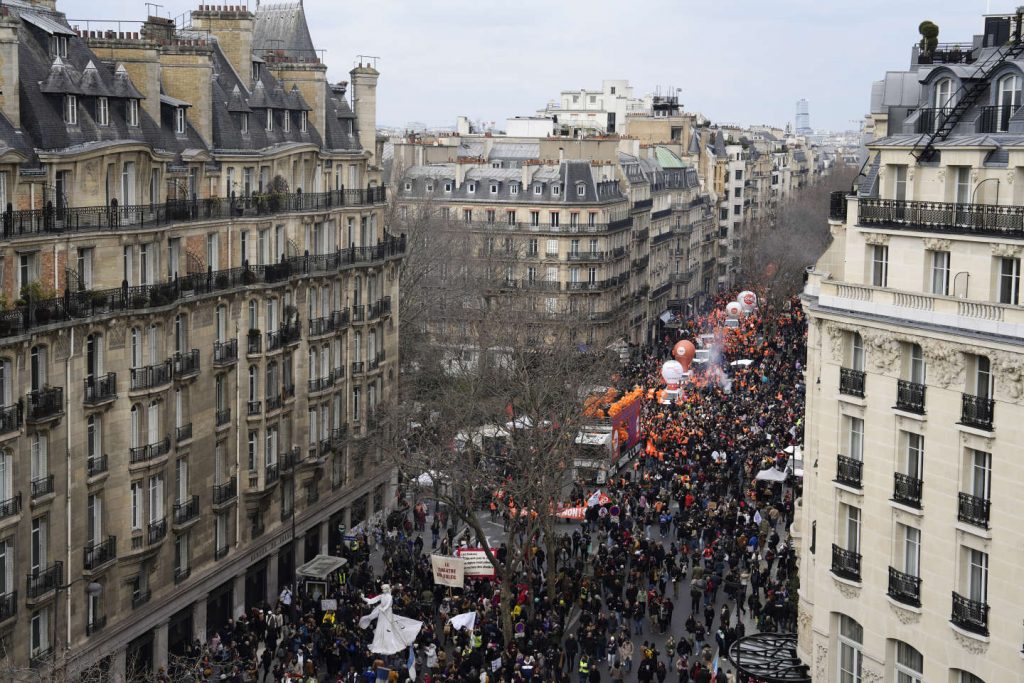 Demonstrators march during a demonstration, Tuesday, March 7, 2023 in Paris. LEWIS JOLY / AP