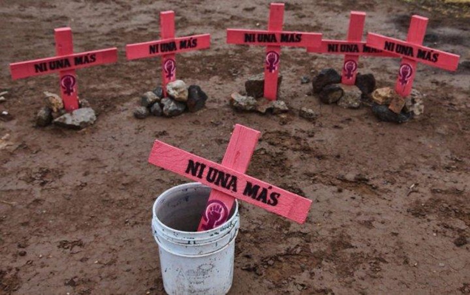 Pink crosses read "Ni Una Mas" as part of the movement against femicide in Mexico.