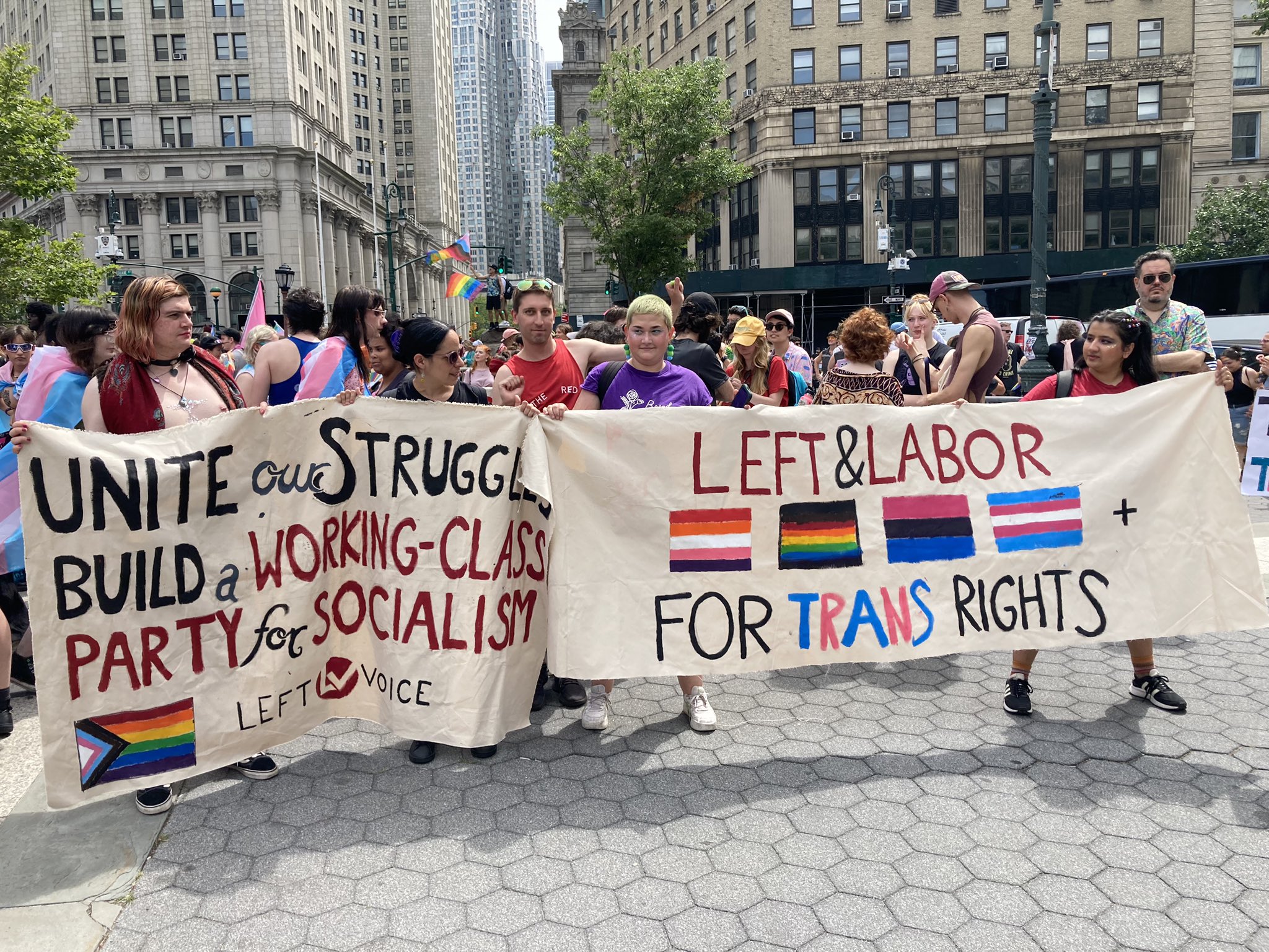 The Left and Labor Coalition at the NYC Queer Liberation March on June 24, 2023. The banners read "Unite our struggles, build a working-class party for socialism" and "left & labor for trans rights."