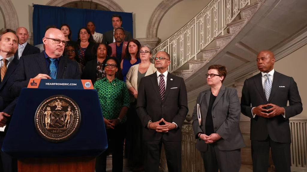 Michael Mulgrew, president of the United Federation of Teachers, is pictured at left during press conference at City Hall Rotunda on June 13.