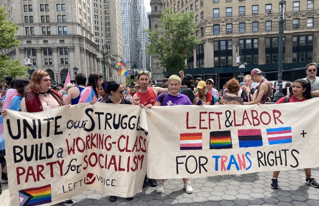 People marching at New York's Queer Liberation March in June. The banner reads "left and labor for trans rights"