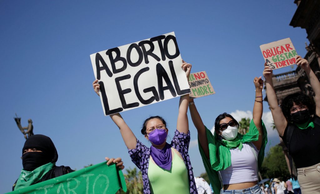 Pro-abortion activists hold up banners reading "Legal abortion" and "Forcing gestation is torture" during a protest against abortion named "For the Life", a week after the Supreme Court of Justice of the Nation (SCJN) decriminalized abortion, in Monterrey, Mexico September 12, 2021.