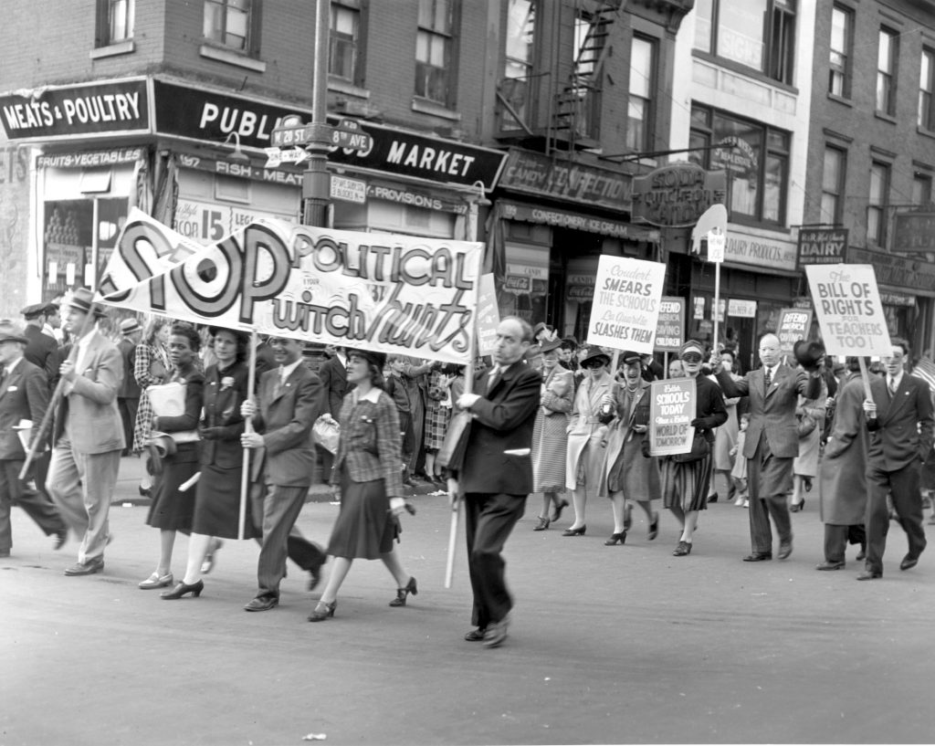 Black and white image of protesters on May Day 1941 in New York. Protesting firings at City College. 