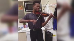 Elijah McClain, a young Black man, playing the violin. He was murdered in the fall of 2019 by Aurora, CO police.