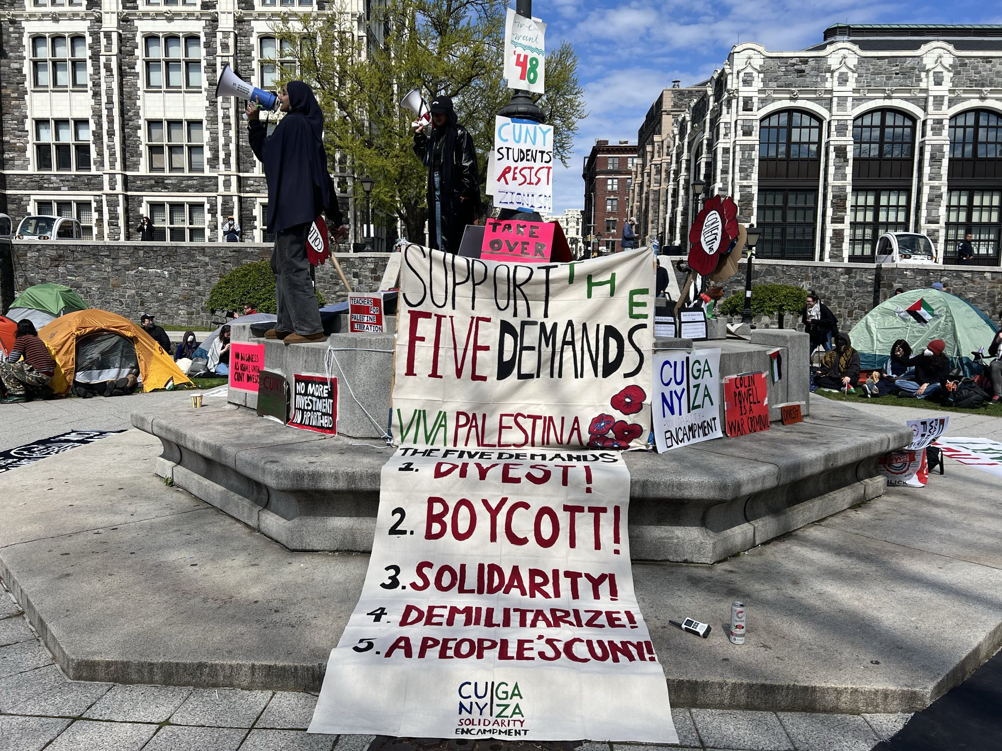 The five demands put forward at the CCNY encampment in solidarity with Palestine: 1. Divest, 2. Boycott, 3. Solidarity, 4. Demilitarization, 5. A People's CUNY. 
April 25, 2024